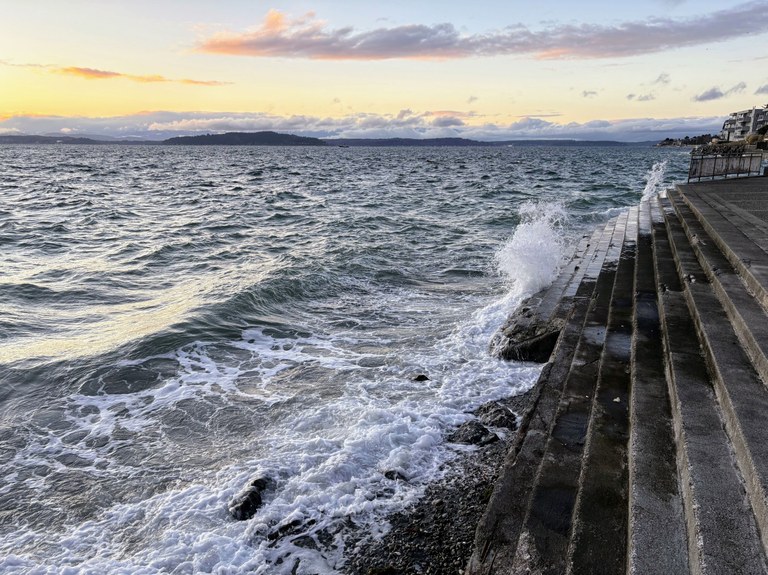 Waves crashing against the steps at Me-Kwa-Mooks park in West Seattle. Photo by trip reporter adbleeker.