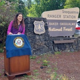 Jill speaking at a podium. Photo by Andrea Imler.