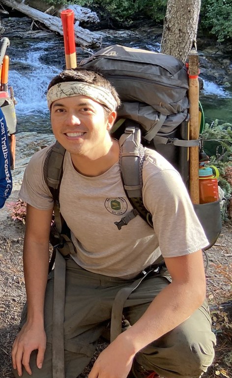 Assistant crew leader Kyvan can't wait to practice leadership skills in his new role. Photo by Kyvan Elep A crewmember crouches with their backpack and tools in tow.
