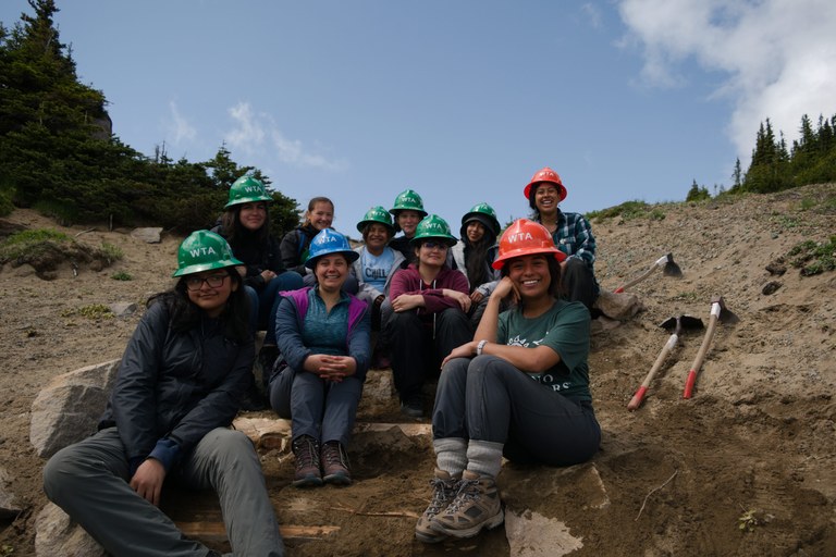 Latina Crew 2019_Iris Zacarias Latina youth and adult crew leaders smile and pose for a group picture on the stairs that they just built at Mt. Rainier. Photo by Iris Zacarias.