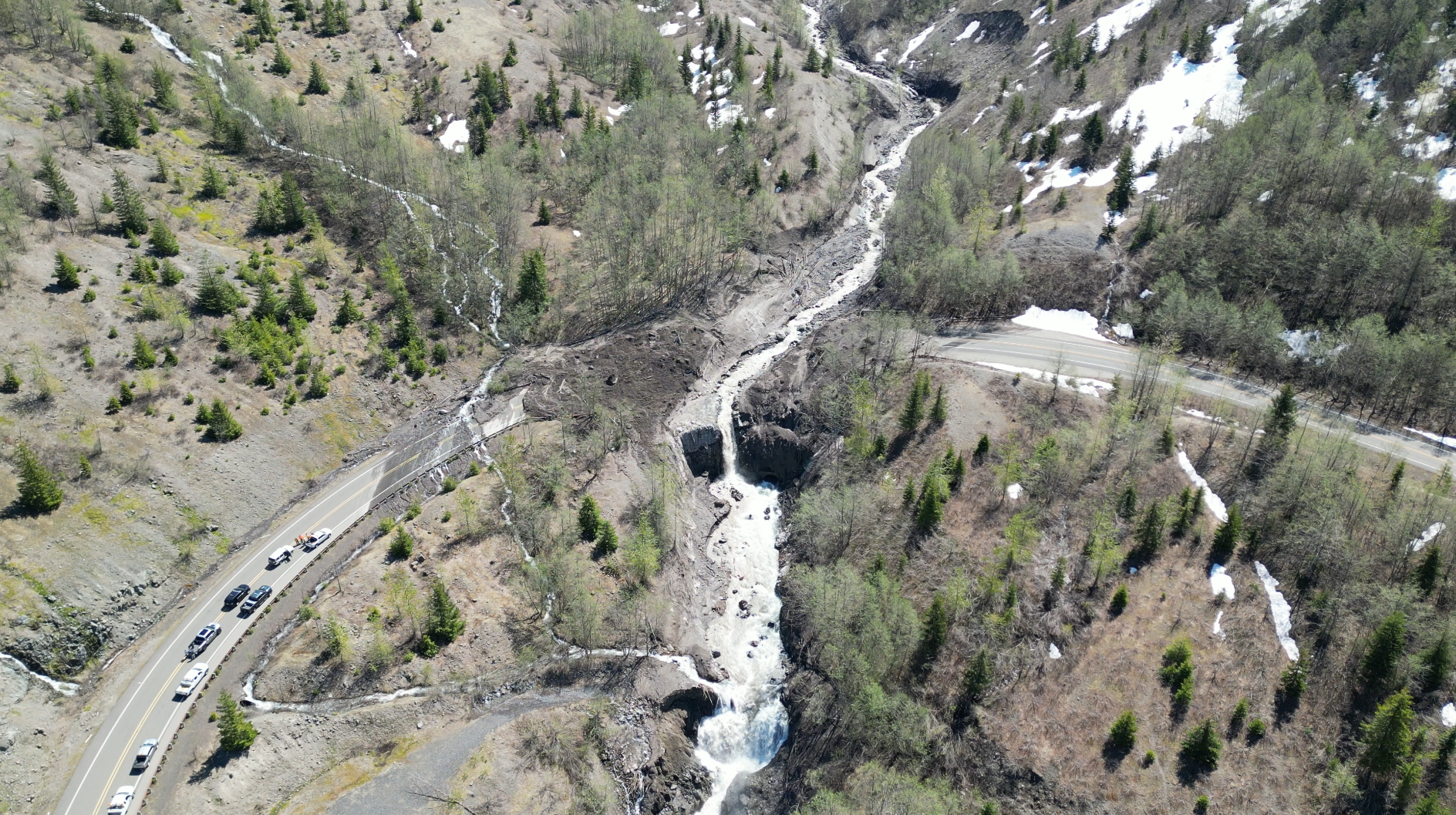 An aerial view of the bridge and road washout on May 15. Credit WSDOT
