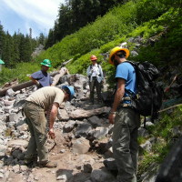 Volunteers fixing tread along the Comet Falls Trail. Photo by John Longsworth.