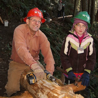 Frank Lacey helps out the Girls Explorer Club on the Two Dollar Trail. Photo by Kathy Bogaards