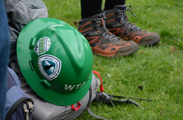 Hard hats sported stickers from all the organizations that helped make Trail Skills College a reality. Photo by Anna Roth. 