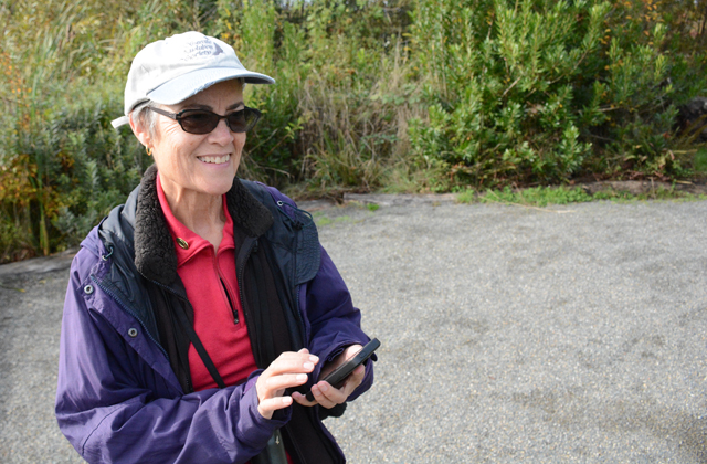 Jan records bird sightings using a smartphone app. Photo by Anna Roth. 