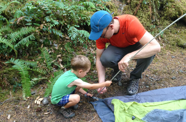 Having kids help set up camp also helps burn off extra energy from the car ride. Photo by Hilary L. Benson. 