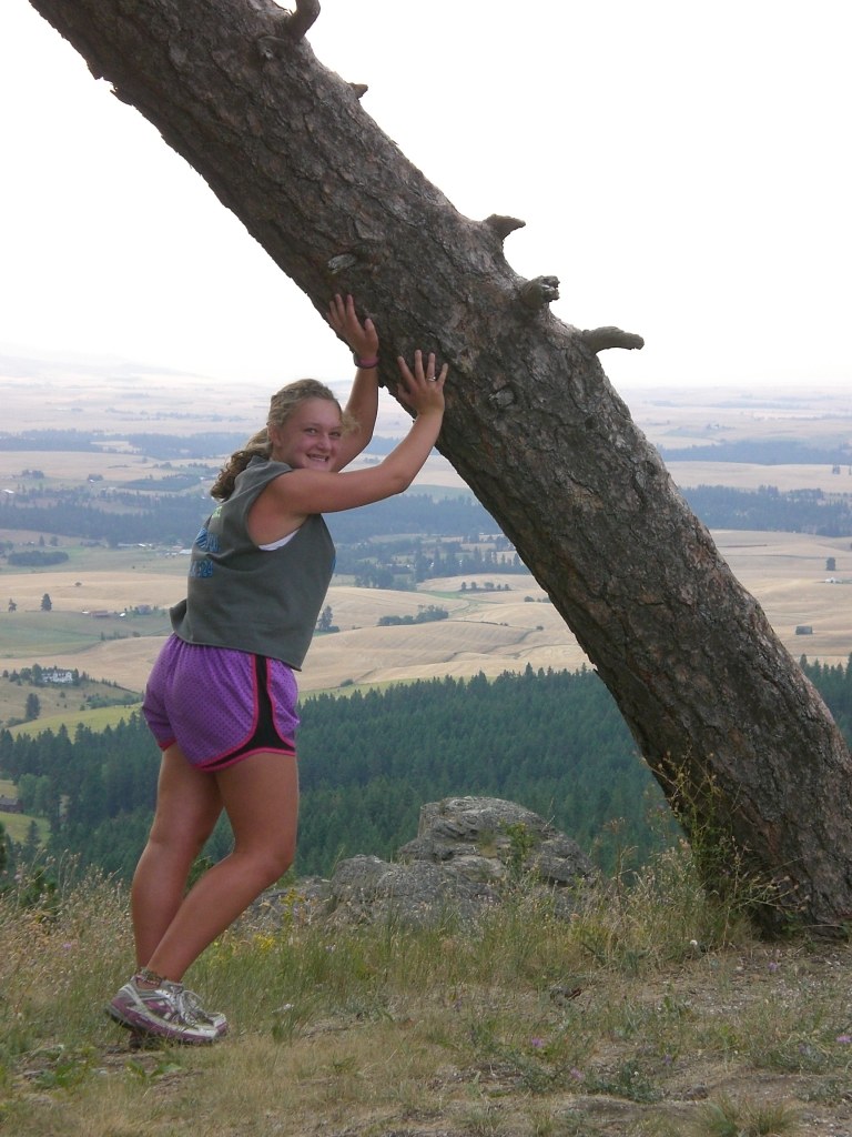One of the freshmen made it to the top! She's so tough, she can hold up this tree!