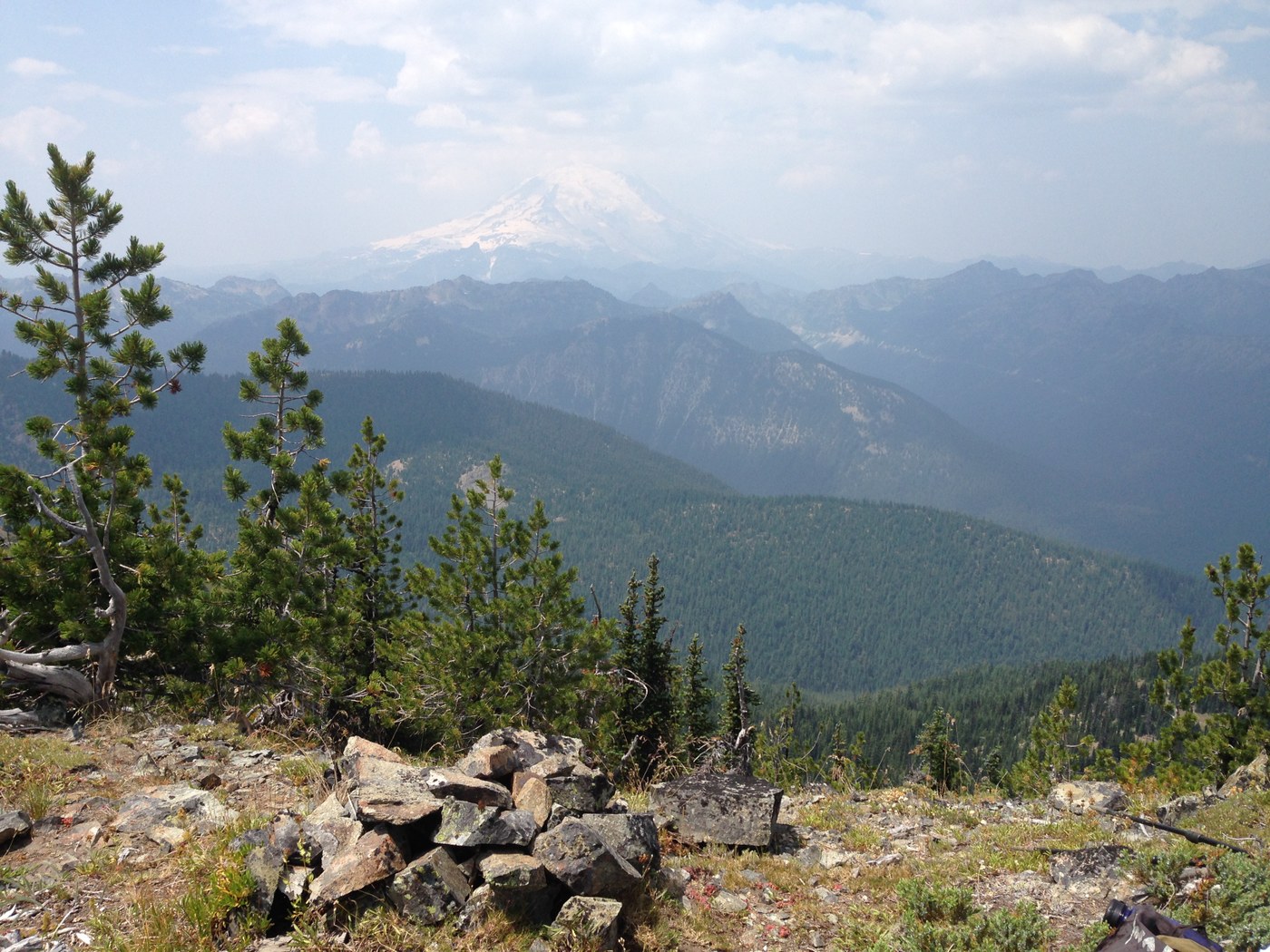 From summit of American Ridge - Mt Rainier through smoke haze