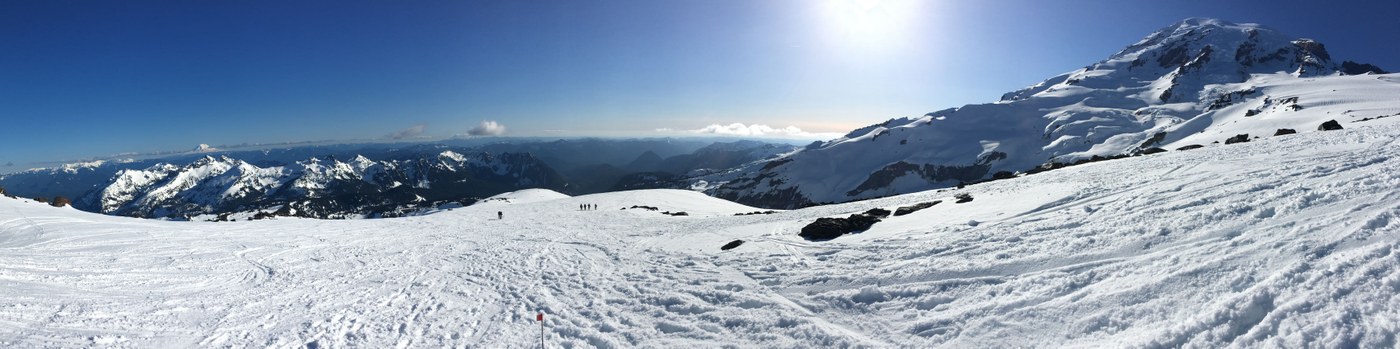 View south of Muir Snowfield near Pebble Creek. Tatoosh range in foreground and Mt. Adams, Mt. Hood and Mount St. Helens juxtaposing in skyline.