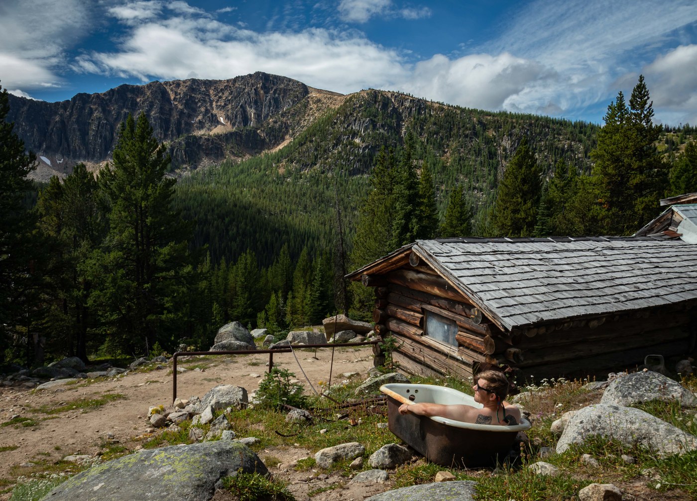 Bath with a view; Kyle at Tungsten Mine. Apex Mountain across the valley.
