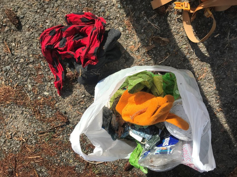 A picture of a bag full of trash picked up from the Little Si trail. Photo by Ms. Math. 